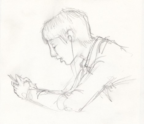 Boy texting — this young man was so engrossed that he barely moved during the time I took to sketch this, about five minutes.