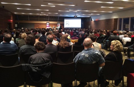 The crowd at the kick-off event! I was in the back row, but the sound was great, and they had the panel up on video screens at the side so those in the back could see the panelists.