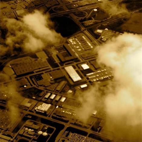 Superman flying over grey Metropolis spots a bank robber